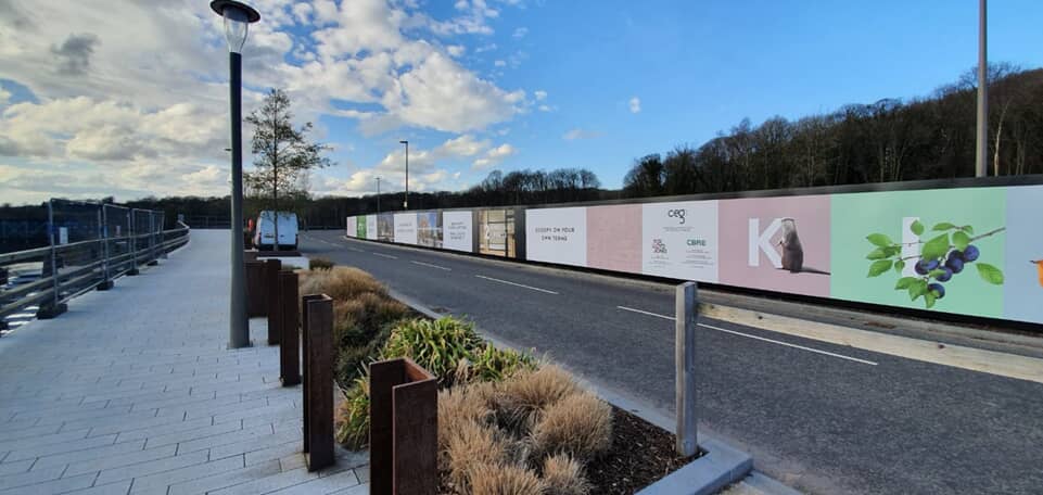 High-resolution printed hoarding graphics.